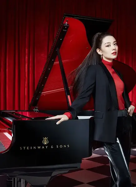 Steinway Artist Gina Alice in front of Steinway Grand Piano