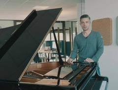 Steinway Spirio | r lover with his concert grand in the office.